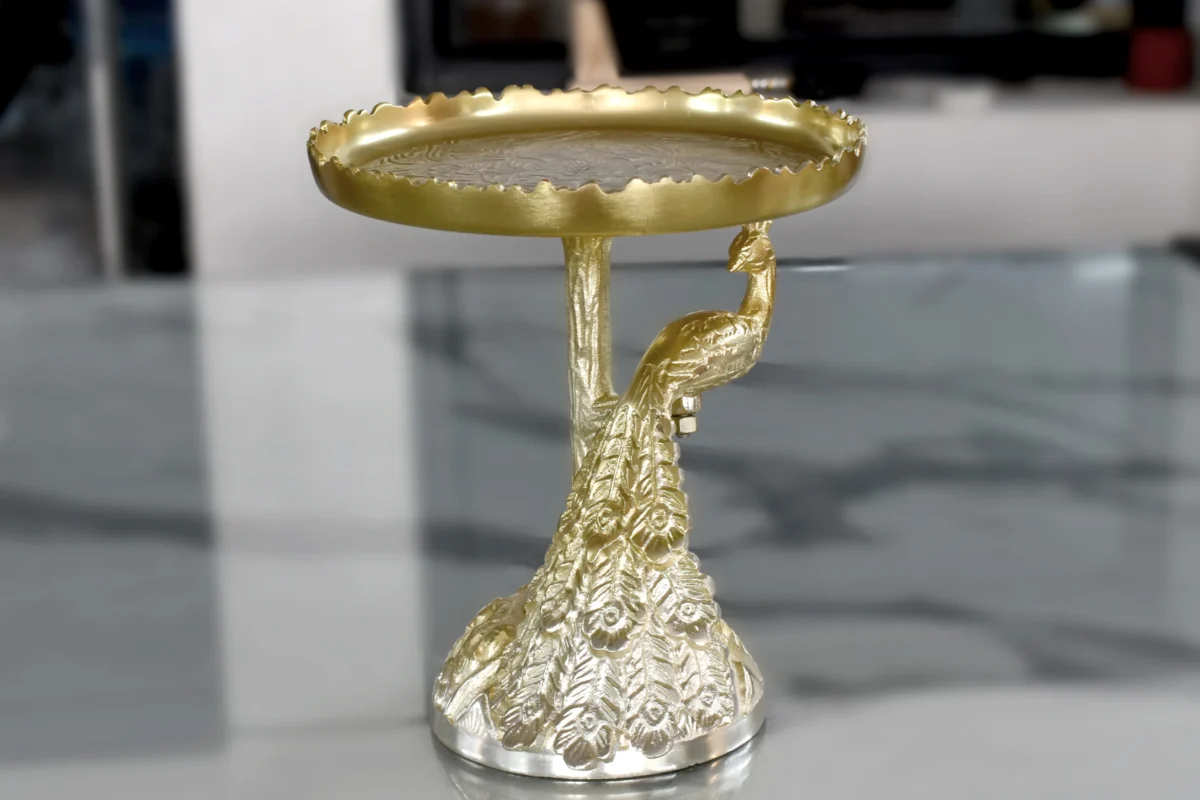 Royal brass peacock pedestal platter designed for luxury wedding return gifts and shaadi hampers.