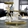 Silver and gold multi-tier floral serving stand arranged in an opulent Diwali and Dhanteras festive hamper.