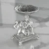 Silver elephant bowl stand styled as an auspicious wedding return gift favor for luxury shaadi hampers.