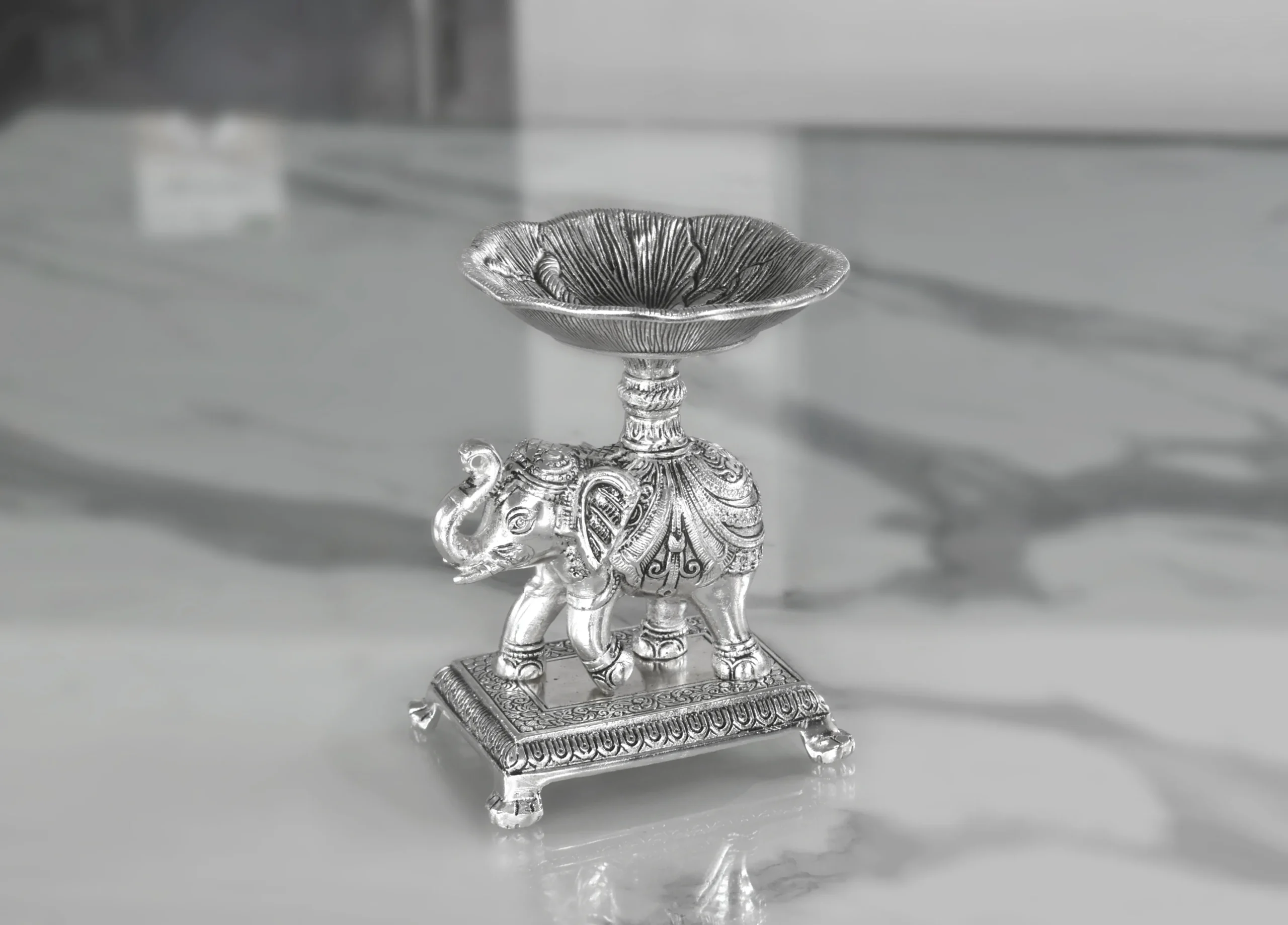Silver plated elephant bowl stand designed for executive corporate festive gifts and business appreciation tokens.