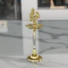 Silver finished peacock pooja diya stand styled for Griha Pravesh and housewarming hampers.