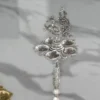 Ornate German silver peacock diya stand presented as an authentic shaadi return gift favor
