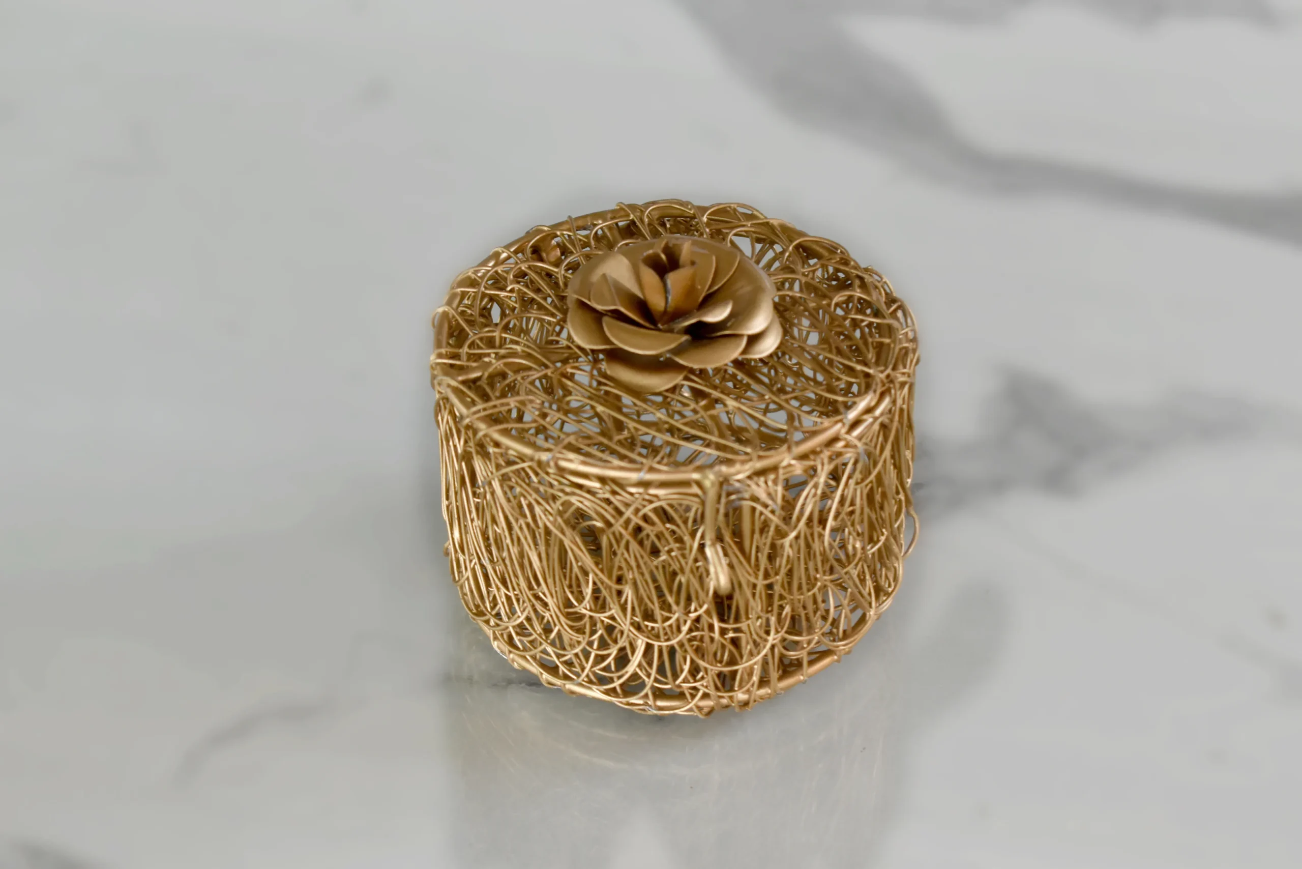 Elegant gold metal gift favor box ideal for Griha Pravesh return gifts and traditional pooja hampers.