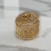 Intricate gold wire trinket container presented as a luxury shaadi return gift box for wedding guests.
