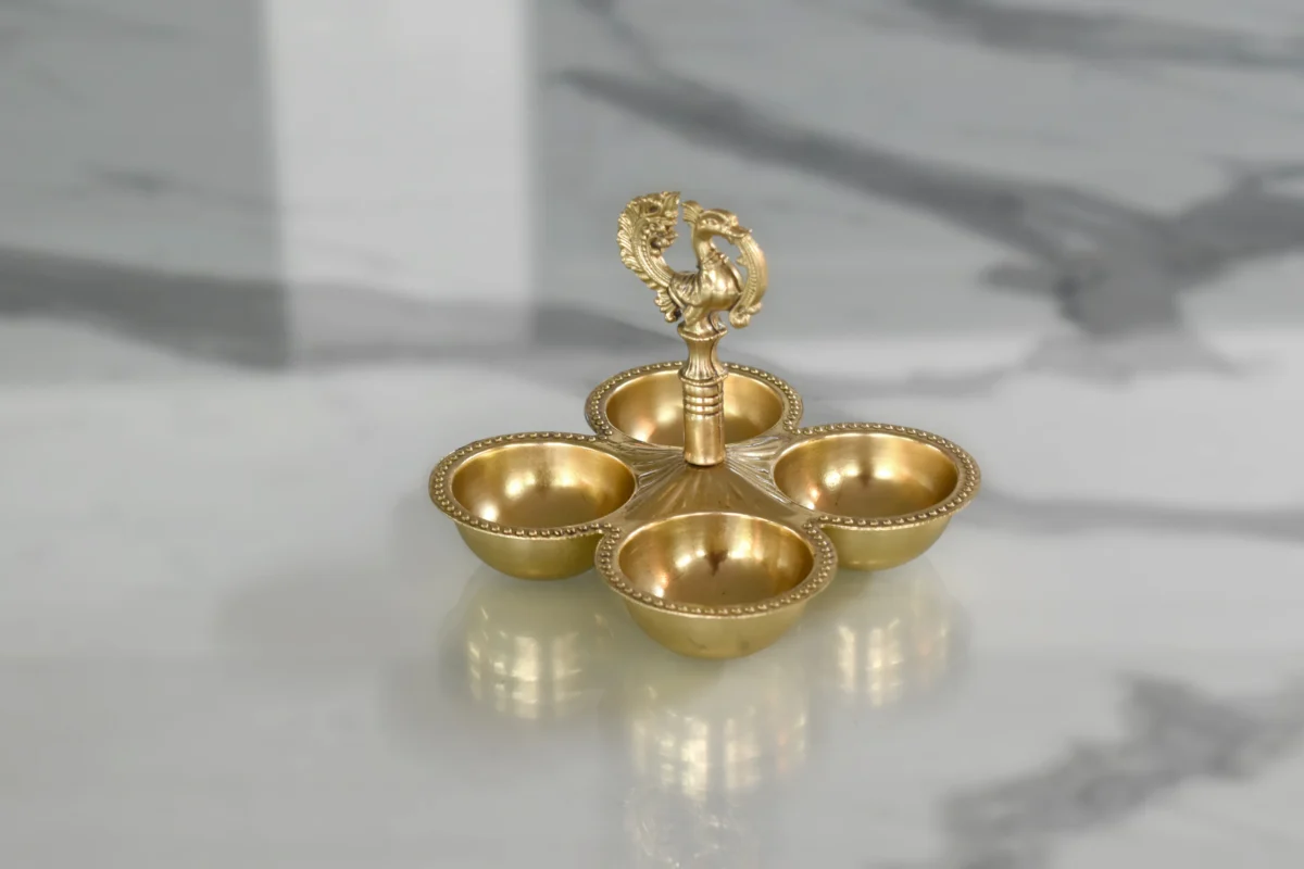 Traditional brass peacock pooja container perfect for Griha Pravesh and housewarming ceremony hampers