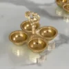 Solid brass peacock multi-bowl pooja platter styled for auspicious Diwali and Dhanteras gifting hampers.