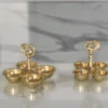 Brass 4-bowl peacock haldi kumkum holder ideal for luxury wedding return gifts and shaadi hampers.