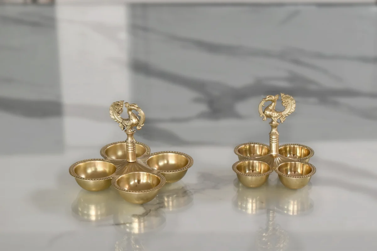 Brass 4-bowl peacock haldi kumkum holder ideal for luxury wedding return gifts and shaadi hampers.