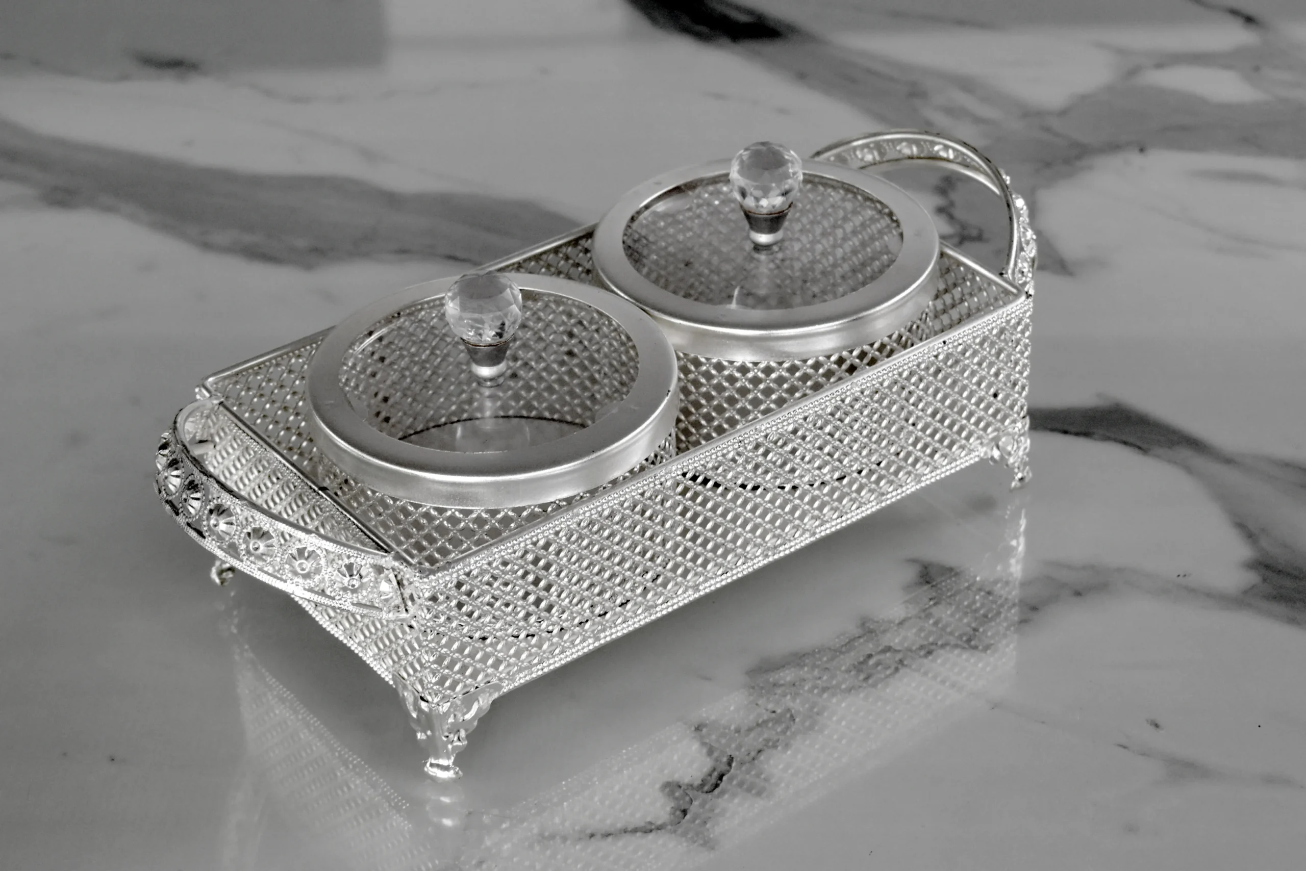 Ornate silver mesh double jar server presented as a luxury shaadi return gift for wedding guests.