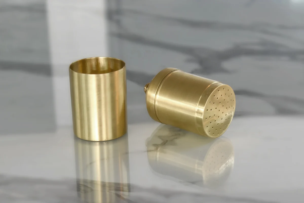 Polished brass filter coffee maker arranged in an opulent Diwali and Dhanteras festive gift hamper.