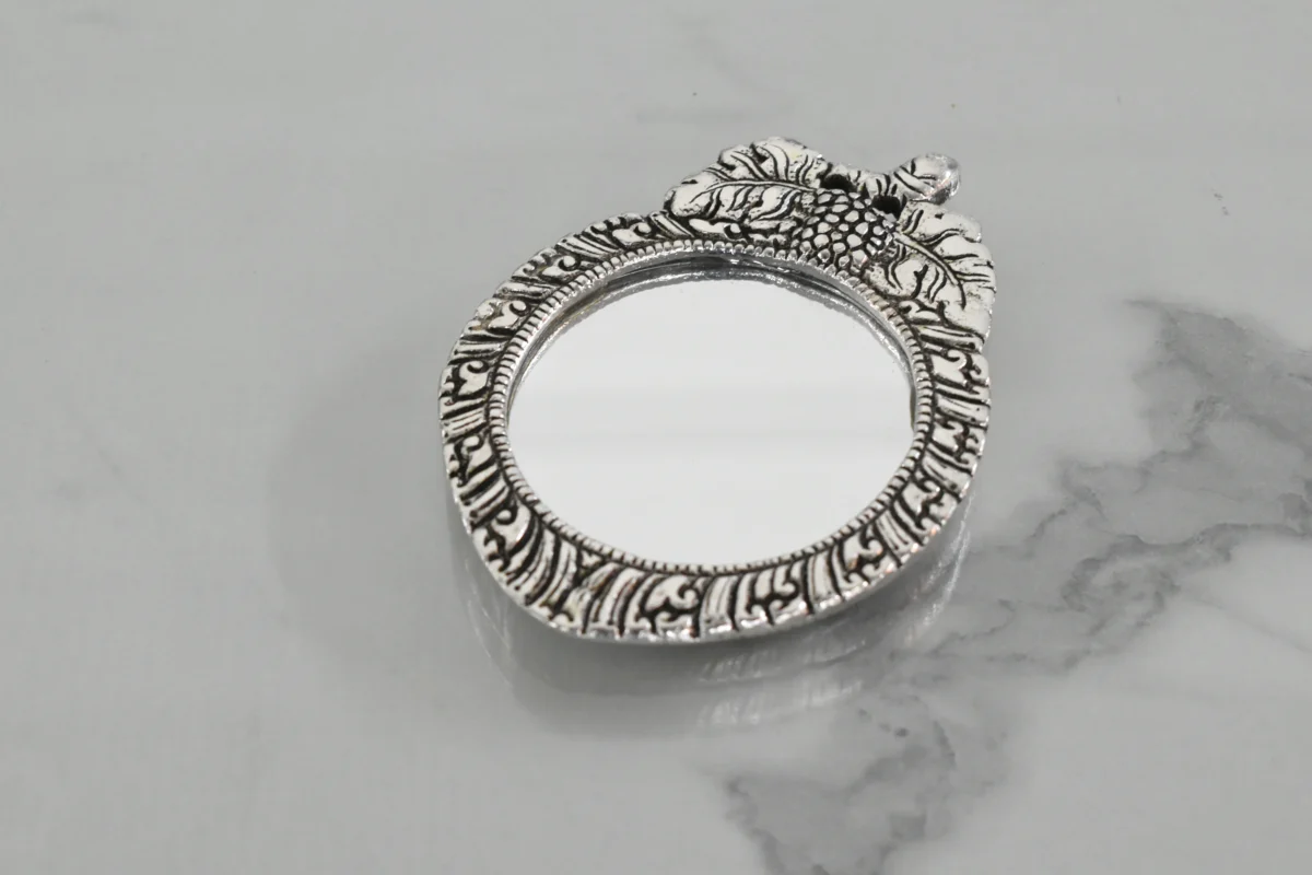 Traditional silver-plated vanity mirrors displayed for Griha Pravesh housewarming and religious ceremonies.