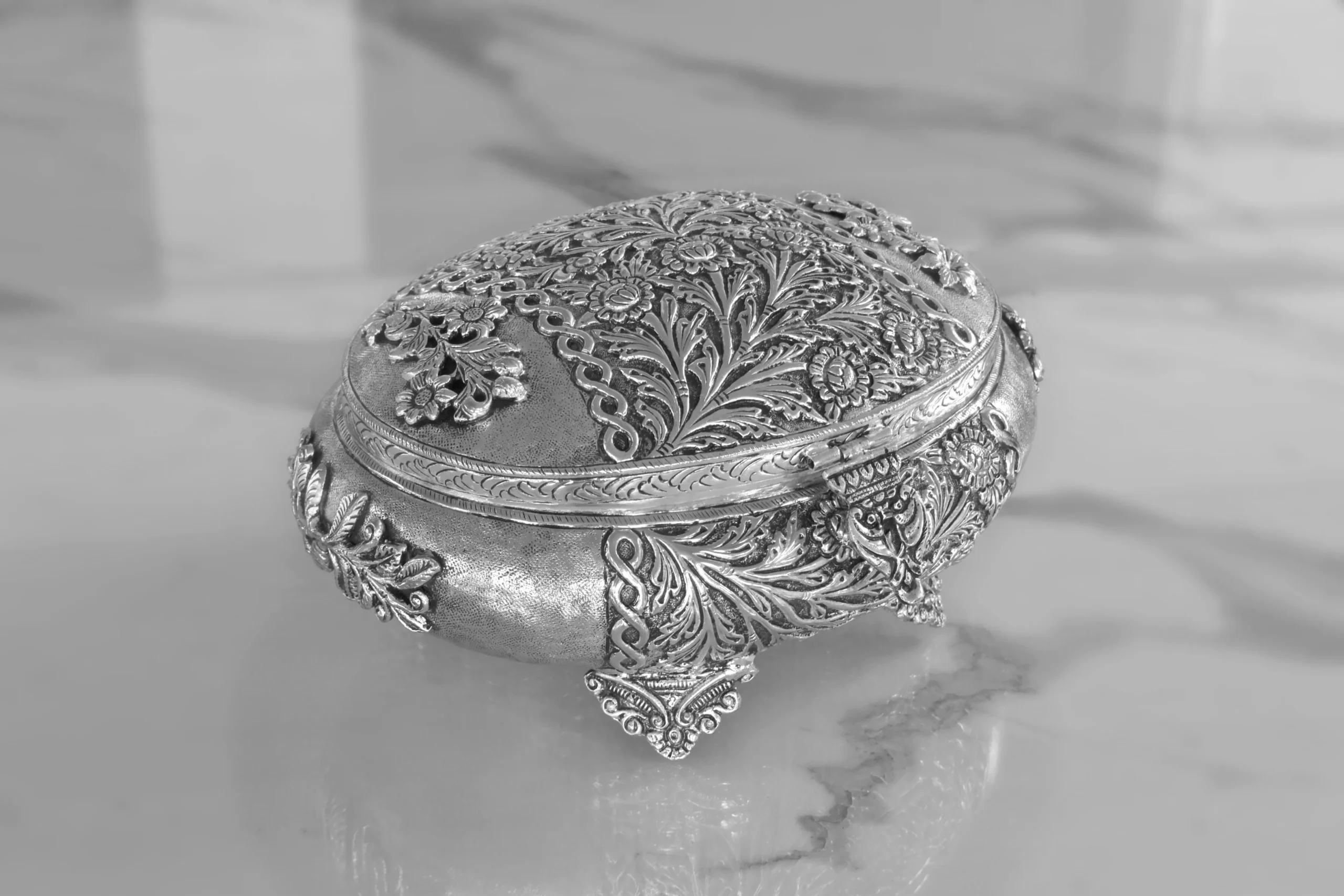 Antique silver oval trinket box arranged inside an opulent Diwali and Dhanteras festive gift hamper