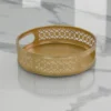Round gold metal tray styled for luxury wedding return gifts and shaadi trousseau hampers.