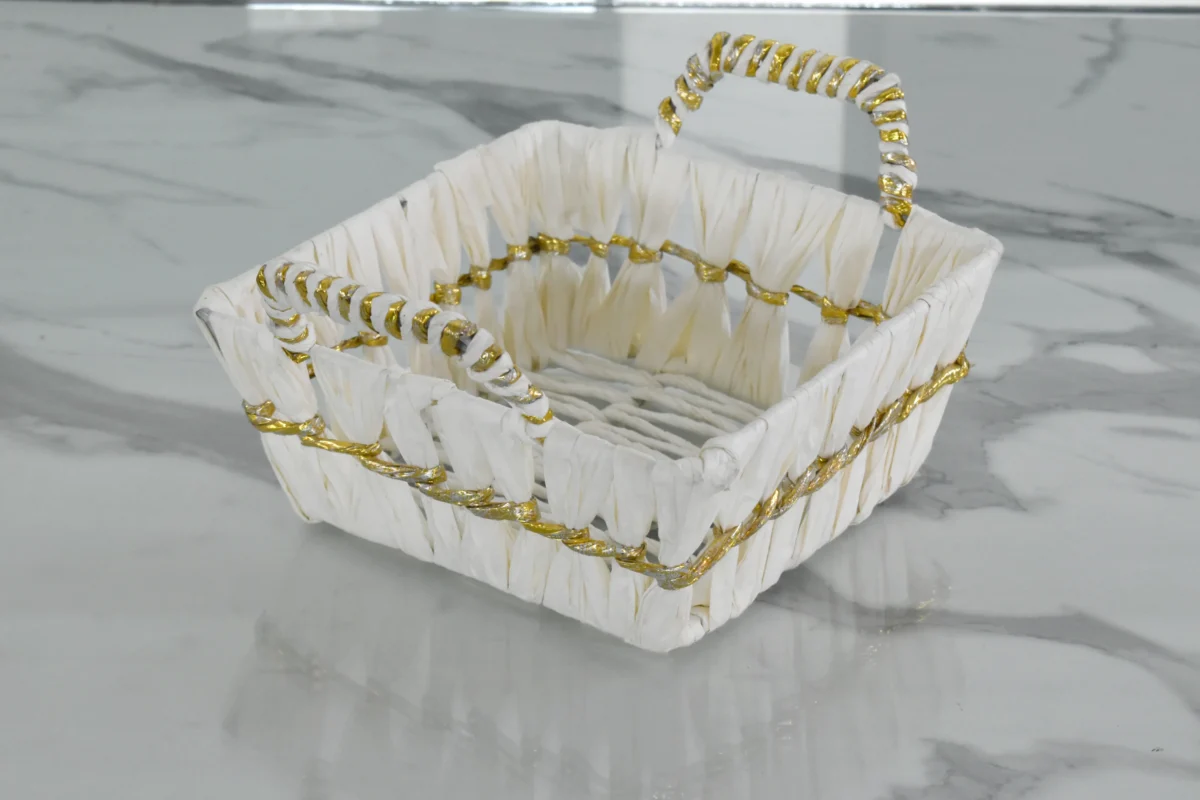 Ornamental square storage basket featured in a Diwali festive hamper and Dhanteras setup.