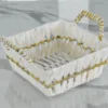 Square decorative woven basket crafted from white paper rope and metal materials.