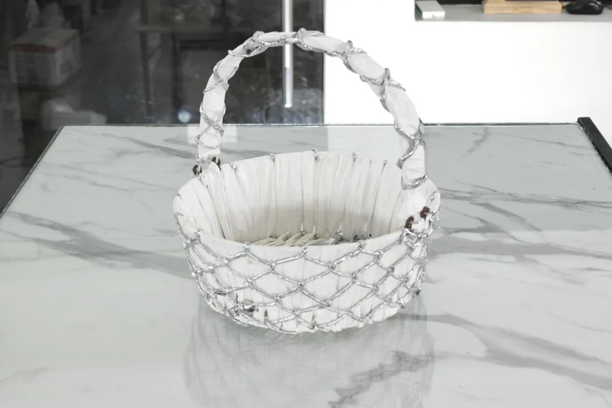 Silver wire mesh gift basket styled for luxury wedding trousseau packing and shaadi ceremony hampers.