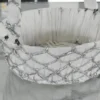 Ornamental silver mesh basket featured in a Diwali festive hamper and Dhanteras gift arrangement.