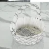 Silver wire mesh gift basket styled for luxury wedding trousseau packing and shaadi ceremony hampers.