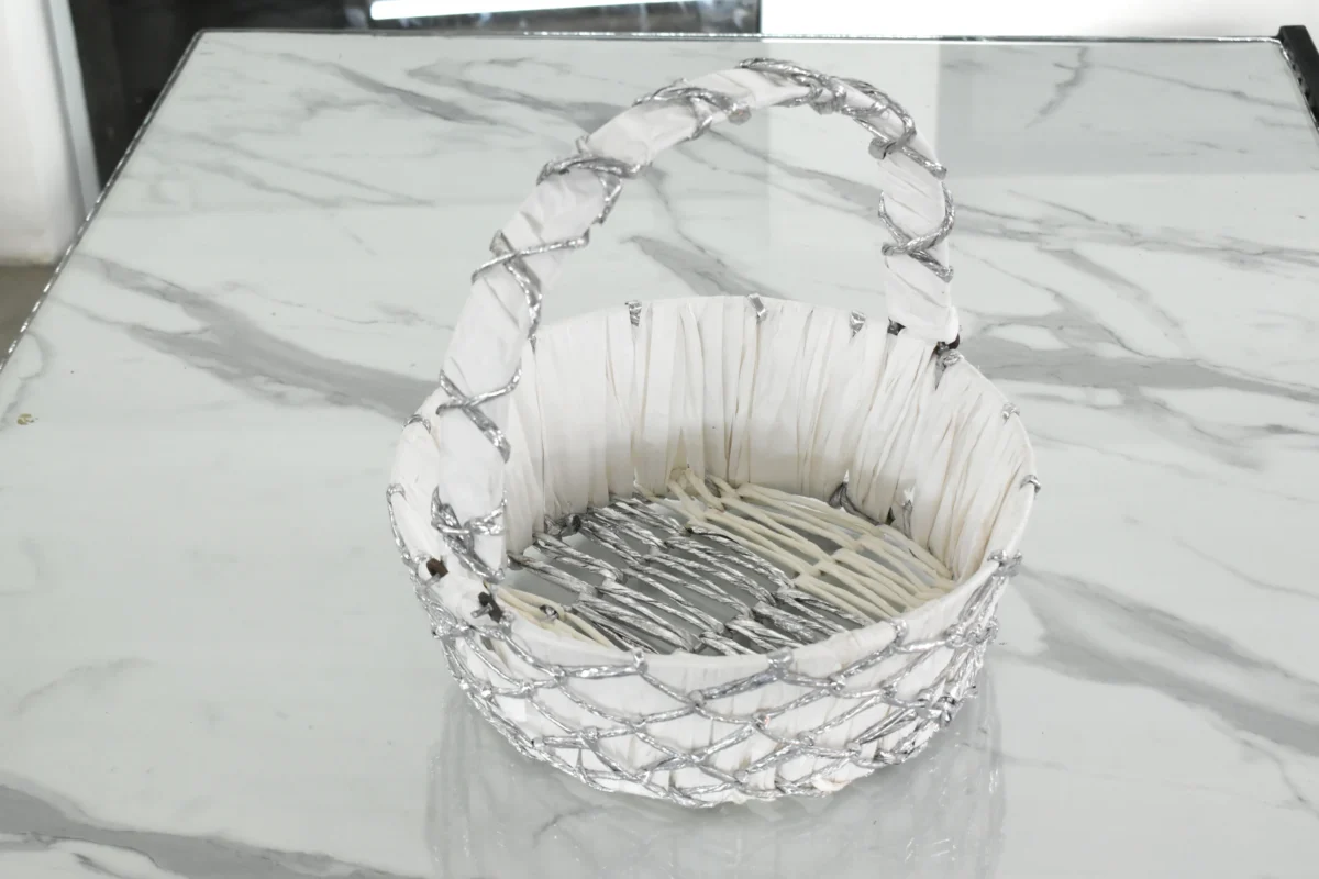 Silver wire mesh gift basket styled for luxury wedding trousseau packing and shaadi ceremony hampers.