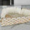 White paper straw and gold mesh decorative heart basket crafted for elegant home styling and storage
