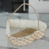 Heart-shaped decorative woven basket crafted from white paper rope and metal materials.