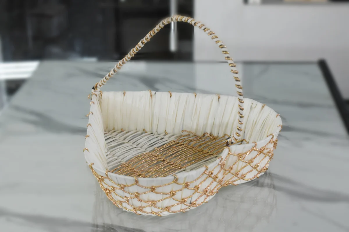 Heart-shaped decorative woven basket crafted from white paper rope and metal materials.