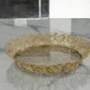 Festive round gold decorative tray arranged for Diwali gift hampers and auspicious Dhanteras celebrations.