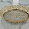 Ornate round gold metal mirror tray styled for luxury wedding return gifts and shaadi trousseau displays