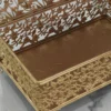 Festive gold-finished decorative storage box arranged for Diwali gift hampers and auspicious Dhanteras pooja celebrations.