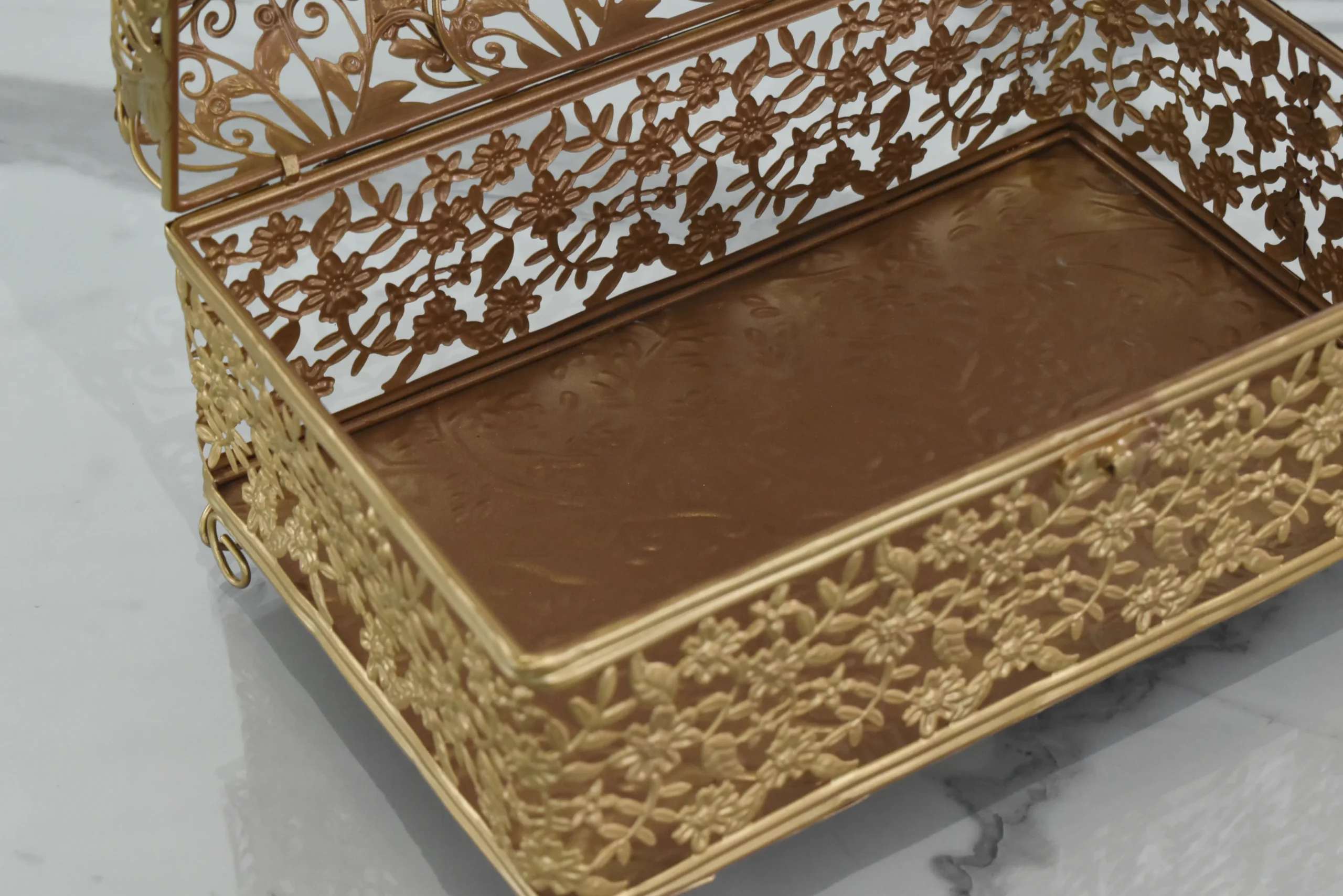 Festive gold-finished decorative storage box arranged for Diwali gift hampers and auspicious Dhanteras pooja celebrations.
