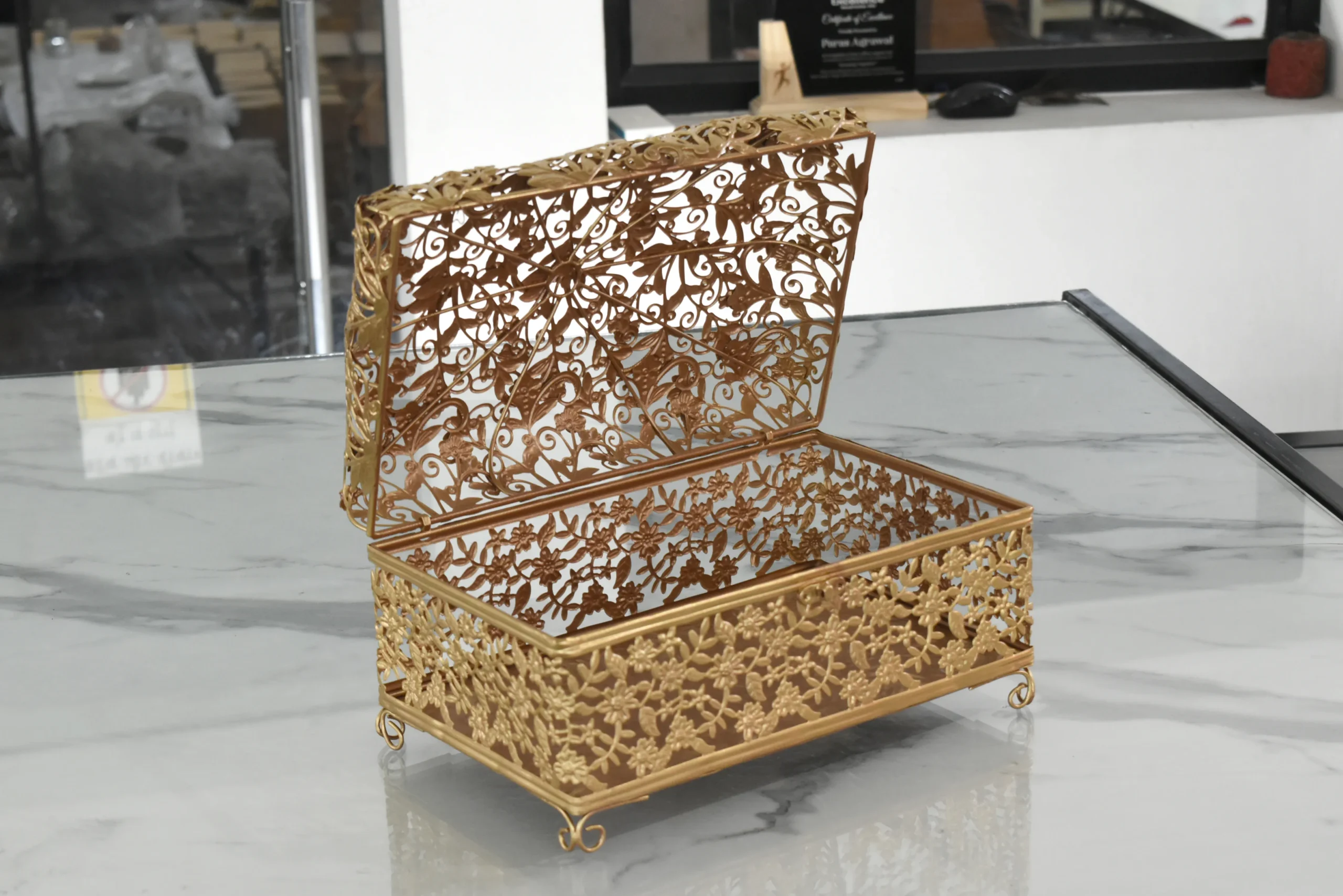 Ornate gold-finished metal filigree box styled for luxury wedding return gifts and shaadi trousseau sets.