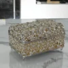 Two-tone gold and silver-plated metal filigree jewelry box with hinged lid and floral lattice design.