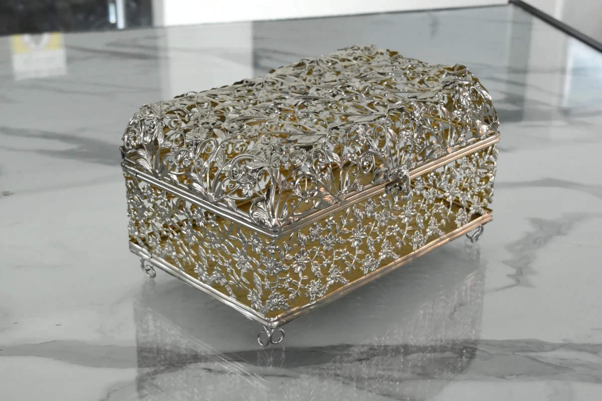 Elegant two-tone filigree keepsake box displayed for Griha Pravesh housewarming and traditional religious ceremonies.