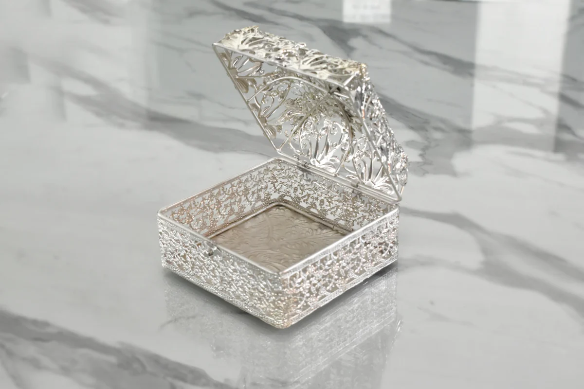 Ornate silver-plated filigree basket styled for wedding return gifts and shaadi trousseau hampers.