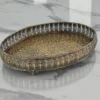 Ornate antique metal oval tray styled for luxury wedding return gifts and shaadi trousseau displays.