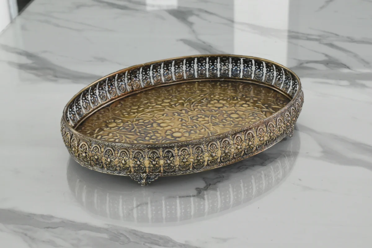 Ornate antique metal oval tray styled for luxury wedding return gifts and shaadi trousseau displays.