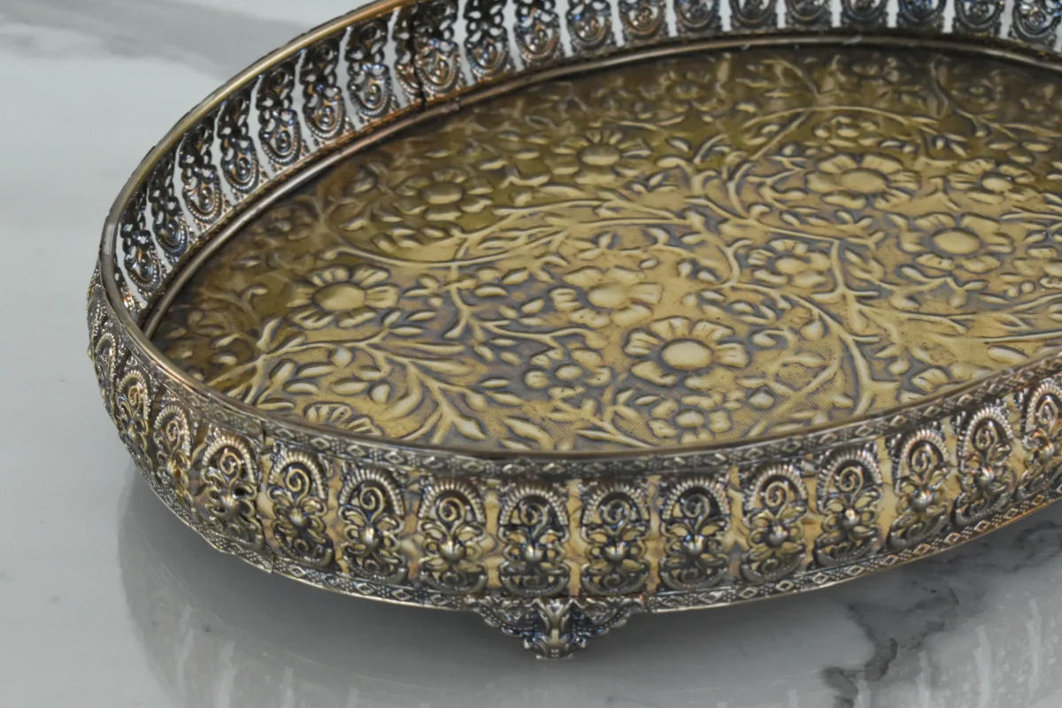 Antique-finished embossed metal decorative oval tray with raised filigree rim for elegant home styling