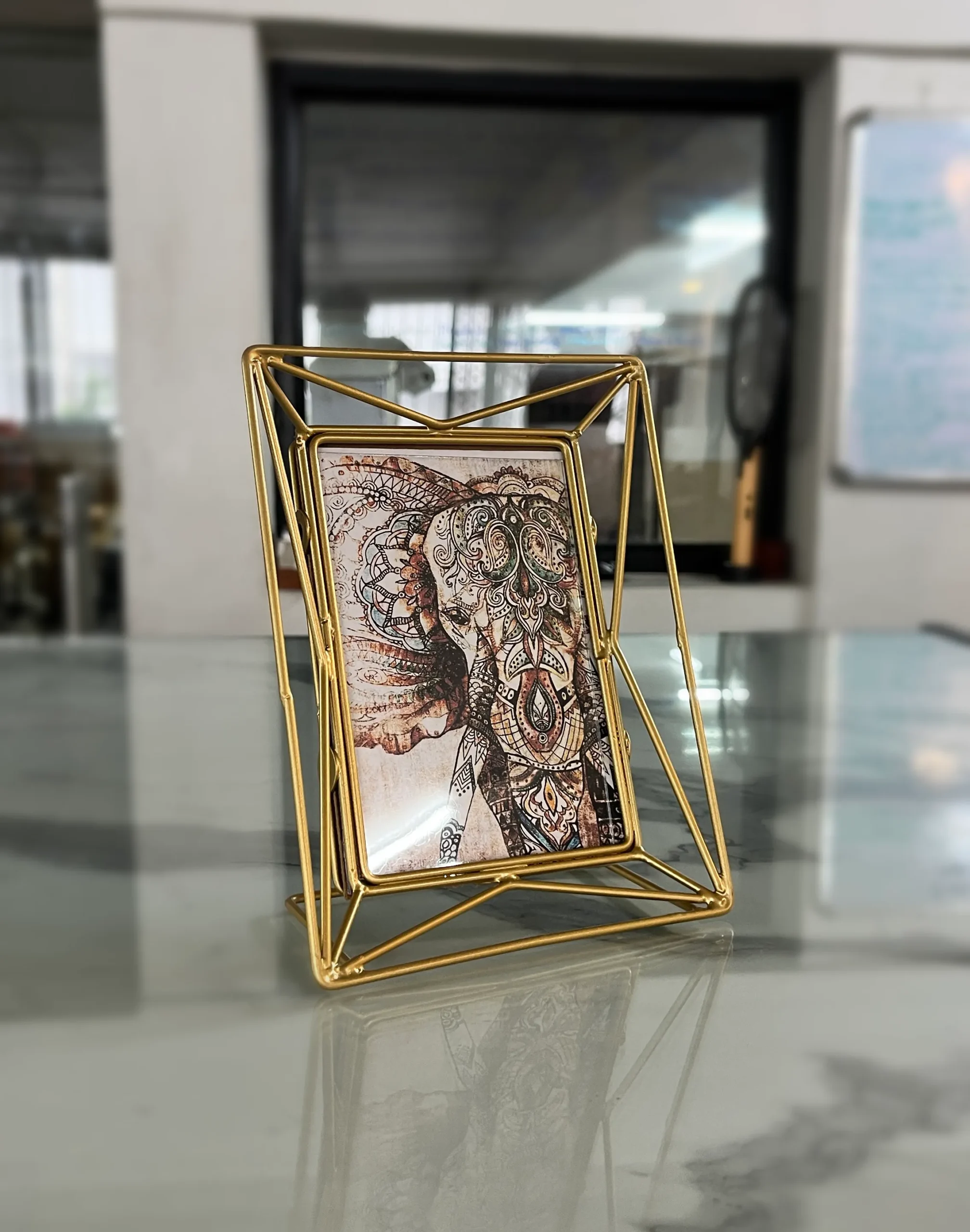 Geometric metal picture frame ideal for Griha Pravesh housewarming gift sets and family celebrations.