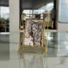 Contemporary gold metal picture frame arranged as part of a Diwali festive gifting and decor collection.