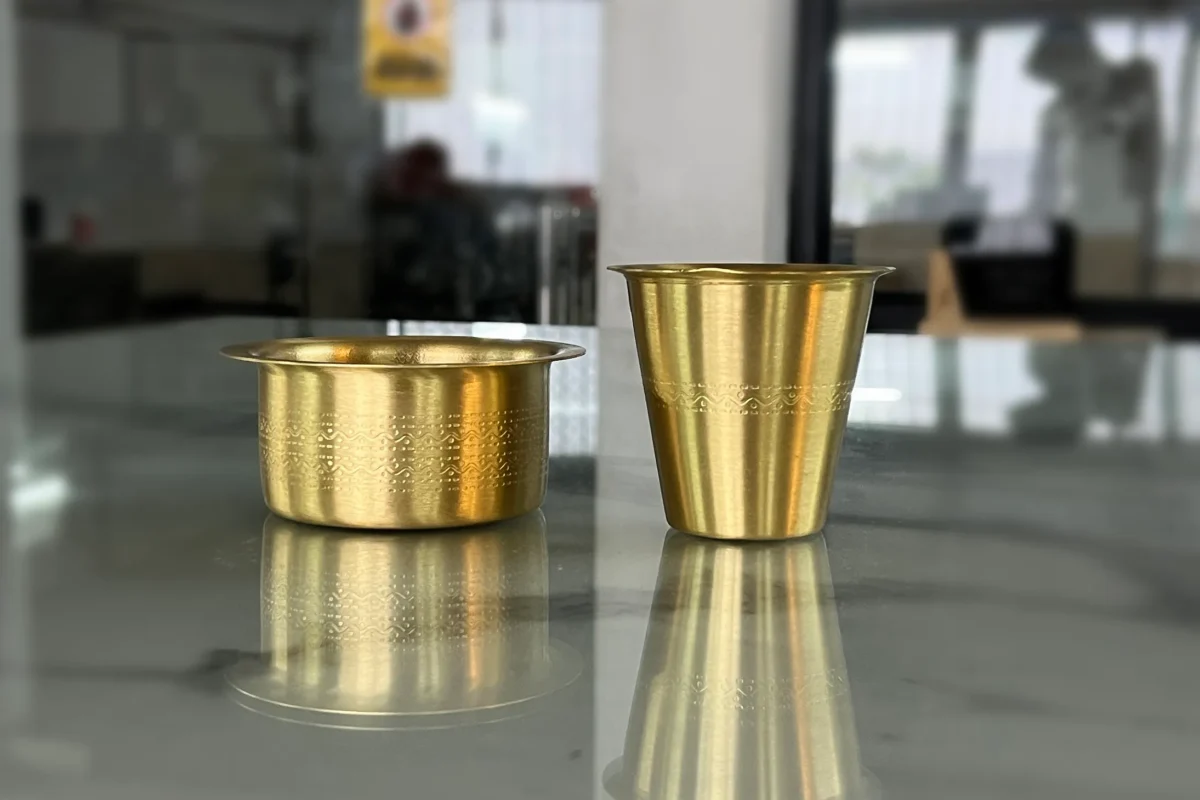 Premium brass coffee tumbler set presented as an exquisite corporate gift for employee appreciation and New Year hampers.