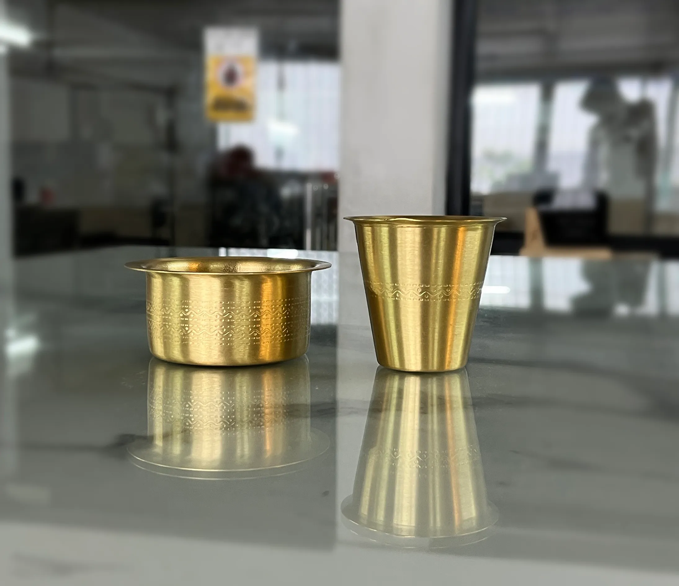 Premium brass coffee tumbler set presented as an exquisite corporate gift for employee appreciation and New Year hampers.