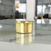 Elegant brass coffee dabarah and tumbler styled inside a wedding return gift hamper for a traditional shaadi.
