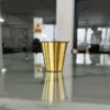 Traditional South Indian brass coffee dabarah set featuring engraved patterns and a matching tumbler.