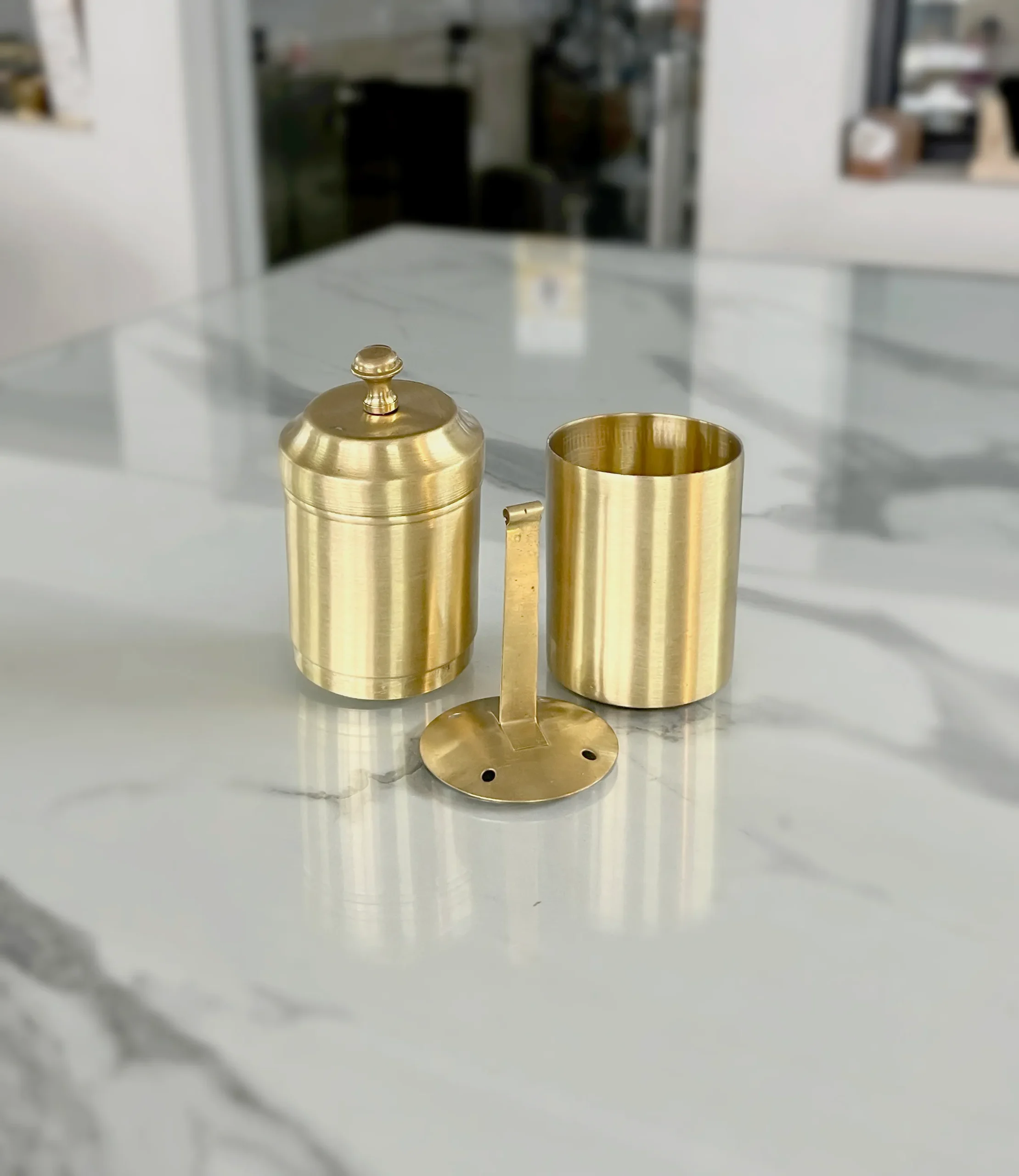 Polished brass filter coffee maker arranged in an opulent Diwali and Dhanteras festive gift hamper.