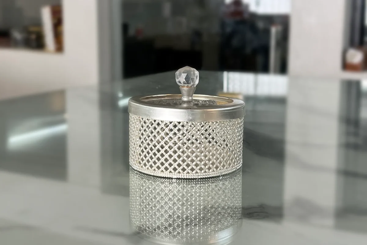 Elegant German silver mesh containers styled as luxury wedding return gifts for a traditional shaadi ceremony.