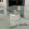 Round German silver mesh storage boxes featuring crystal-cut knob lids and intricate lattice metalwork.