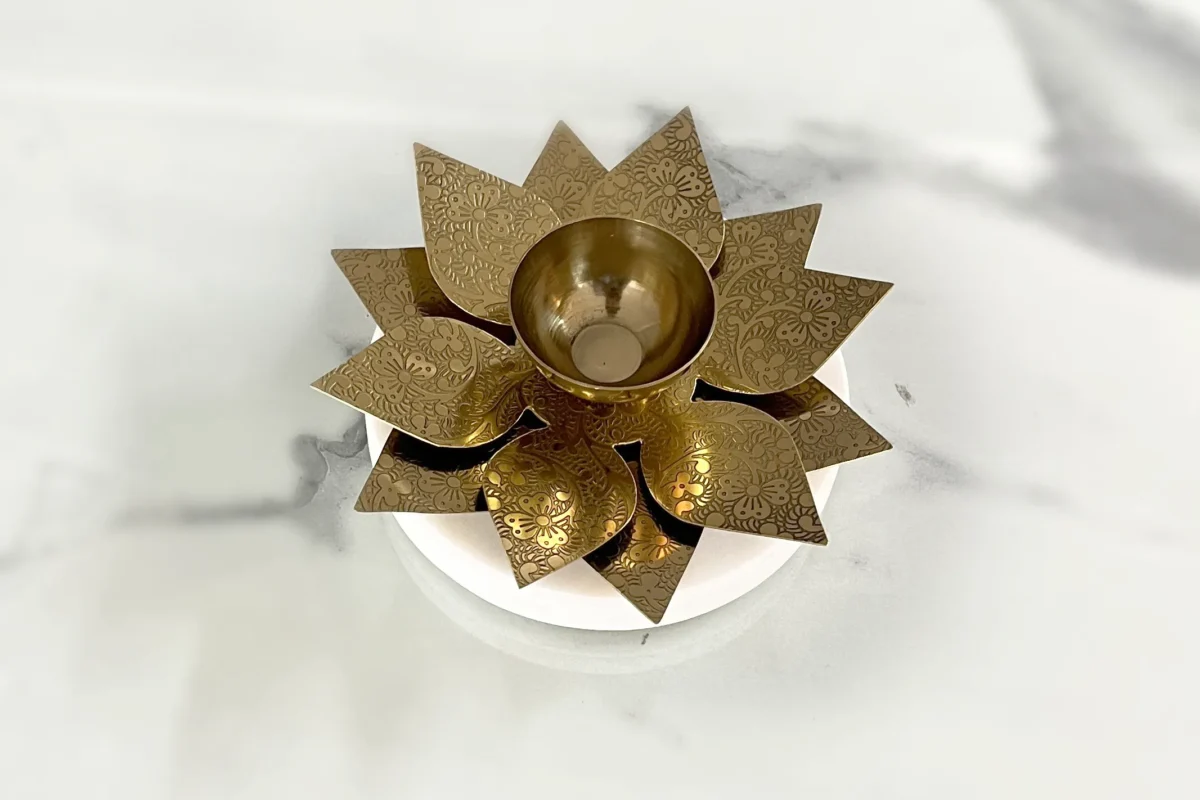 Traditional metal lotaus diya for Diwali pooja, perfect for festive decor collections and Dhanteras gifting ceremonies.
